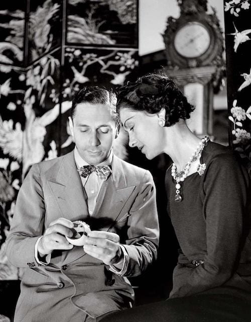 Duke Fulco di Verdura presenting Coco Chanel with her Maltese Cross bracelet, ca. 1935.